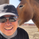 Qing Cao with a Przewalski's horse